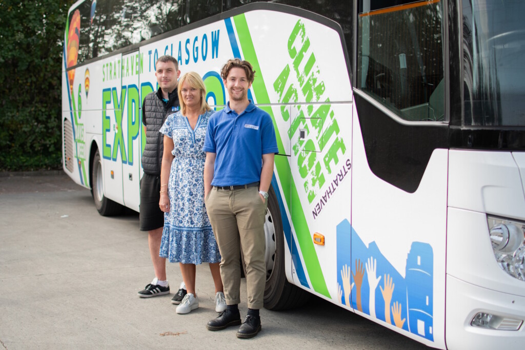 (Left to right) Mark Allan (Climate Action Strathaven), Alison Harley (Climate Action Strathaven), Michael Newton (Banks Renewables) lifeline bus service route 